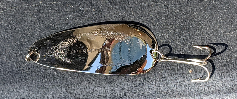 Close-up photo of an Elmer Hinckley spoon with a tarnished finish